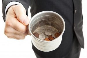 9969439-closeup-of-a-businessman-with-a-tin-cup-begging-for-change-white-background-1